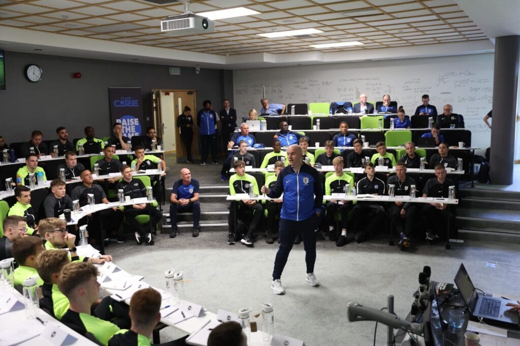 A coaching session at the FA Core, with participants engaged in a learning environment.