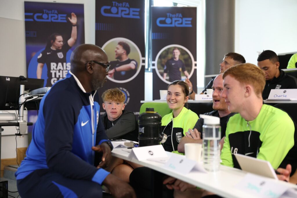 Interactive training environment at The FA Core with participants and instructors.