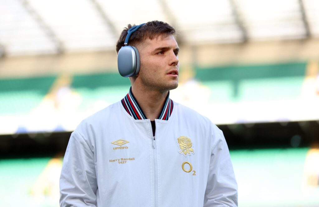 Harry Randall wearing headphones before a rugby match.