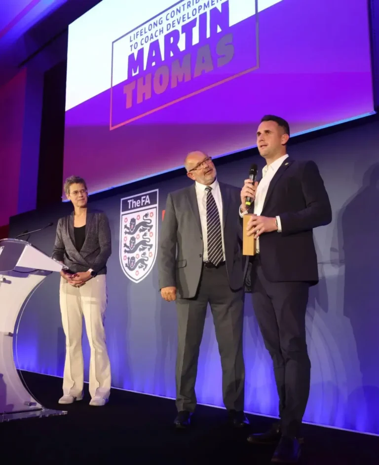 A moment from the coach development award ceremony featuring Martin Thomas.