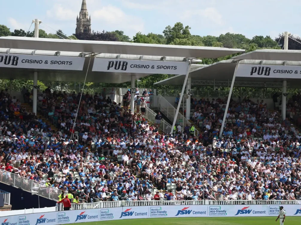 A vibrant crowd enjoying a cricket match in a stadium.