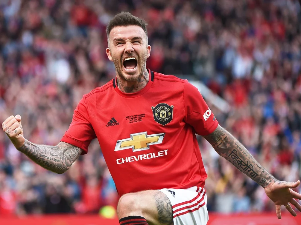 David Beckham celebrating on the football pitch