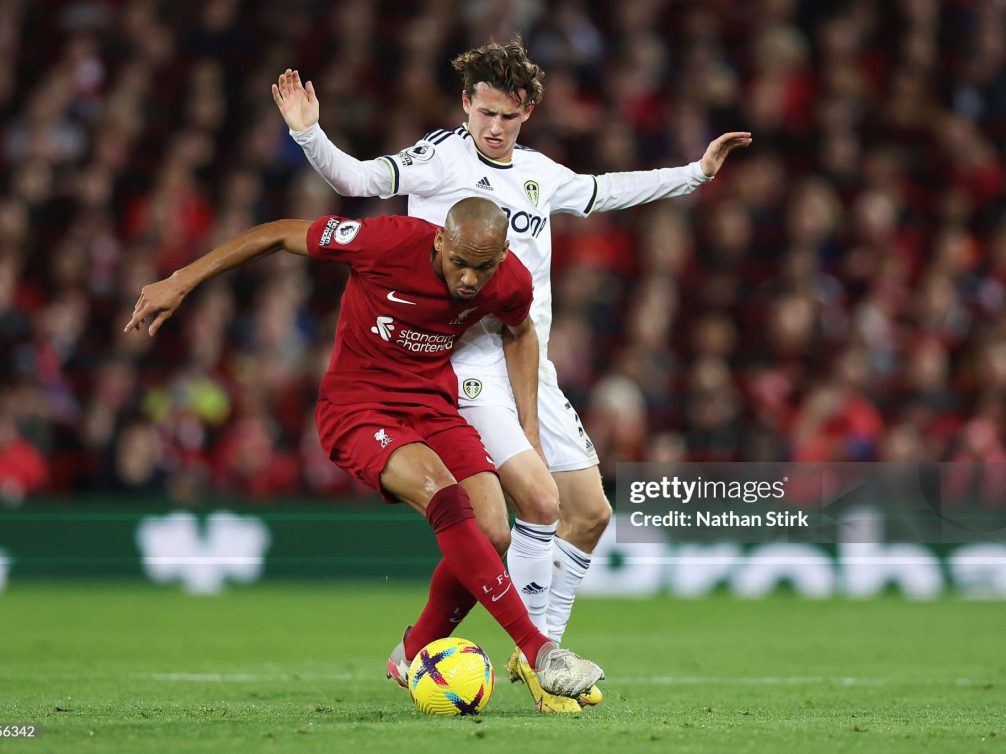 LIVERPOOL, ENGLAND - OCTOBER 29: Fabinho of Liverpool battles for possession with Brenden Aaronson of Leeds United during the Premier League match between Liverpool FC and Leeds United at Anfield on October 29, 2022 in Liverpool, England. (Photo by Nathan Stirk/Getty Images)