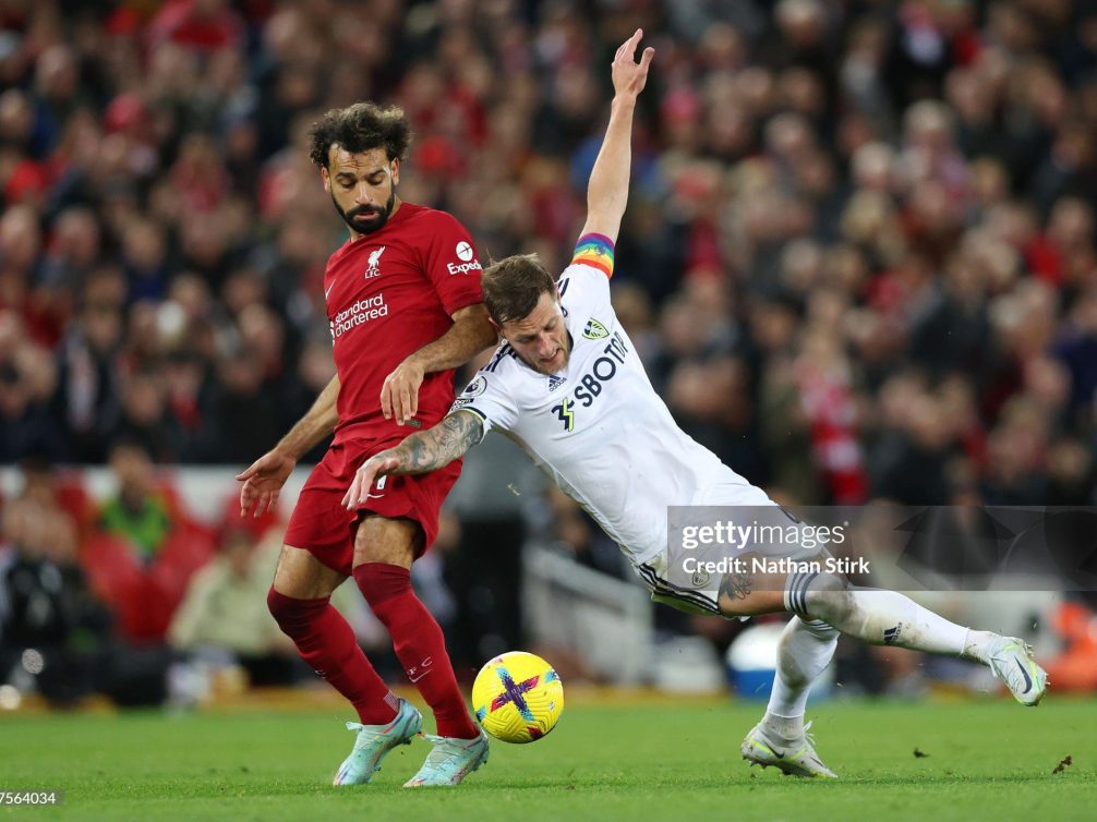 LIVERPOOL, ENGLAND - OCTOBER 29: Mohamed Salah of Liverpool battles for possession with Liam Cooper of Leeds United during the Premier League match between Liverpool FC and Leeds United at Anfield on October 29, 2022 in Liverpool, England. (Photo by Nathan Stirk/Getty Images)