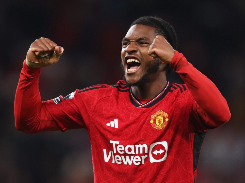 Manchester United player celebrating a goal with excitement.