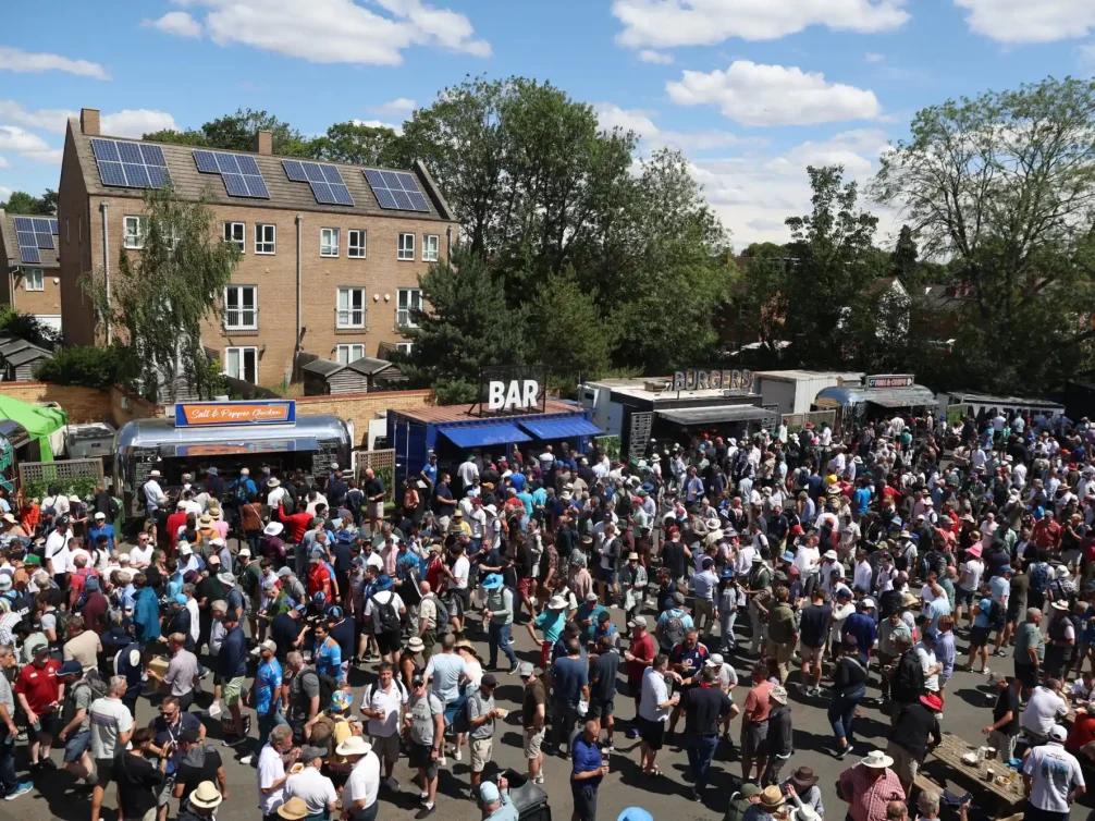 An outdoor event featuring food stalls and a lively atmosphere.