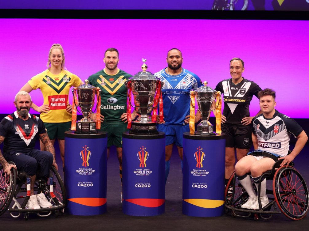 Rugby players showcasing their trophies during the Rugby League World Cup 2023.