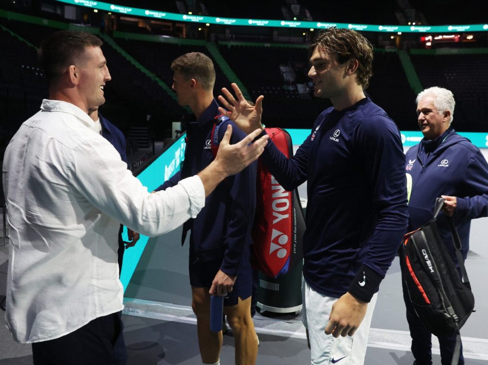 Tom Curry, Sale Sharks Rugby Player, interacts with Jack Draper of Great Britain prior to the Group Stage tie between Great Britain and Argentina in the Davis Cup Finals at AO Arena on September 13, 2024 in Manchester, England